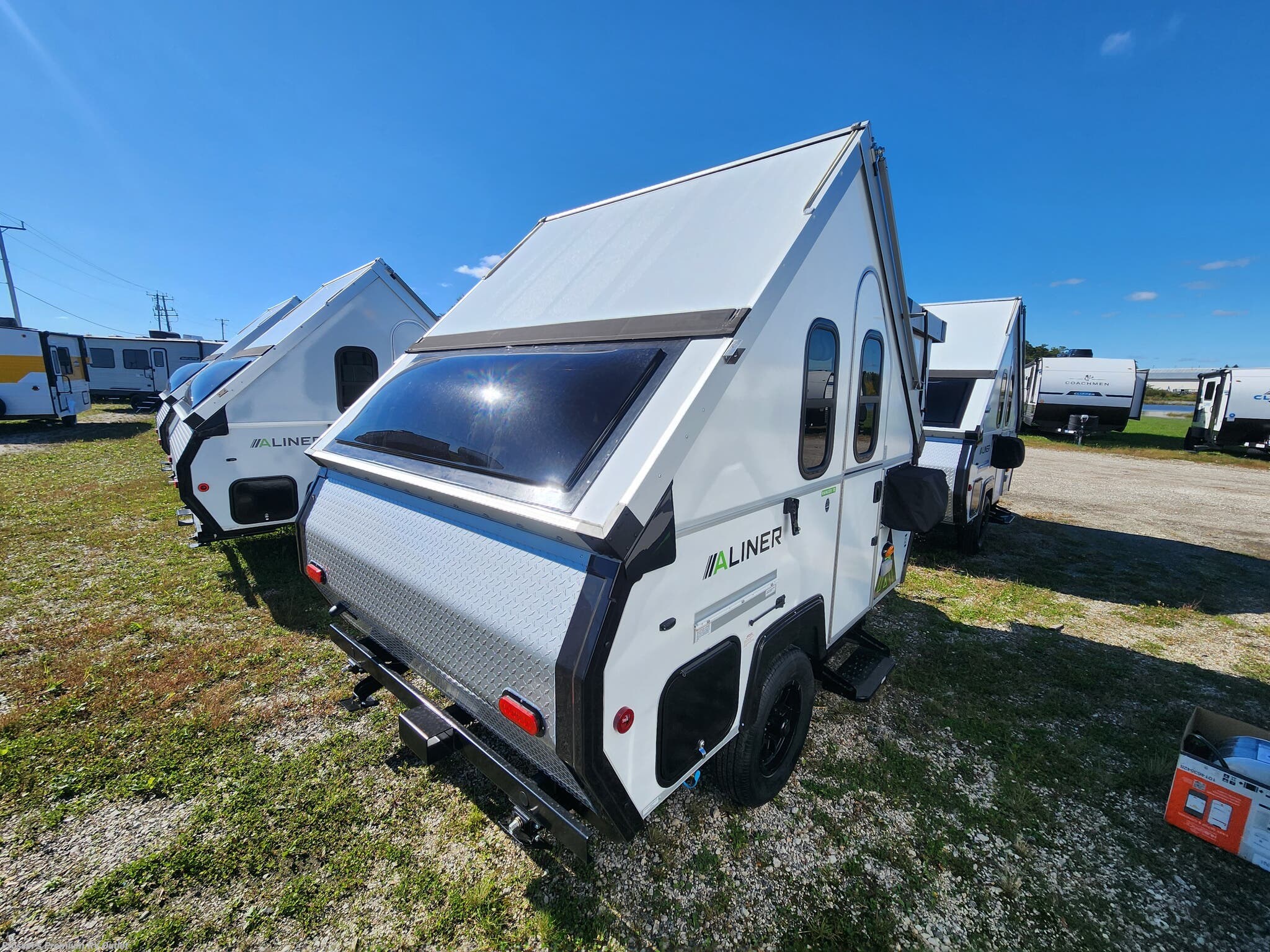2027 Aliner Ranger 10 REAR DINETTE - New Expandable Trailer For Sale by Prosser's Premium RV Outlet in Sturtevant, Wisconsin features Refrigerator, Microwave, Stove Top Burner, Air Conditioning