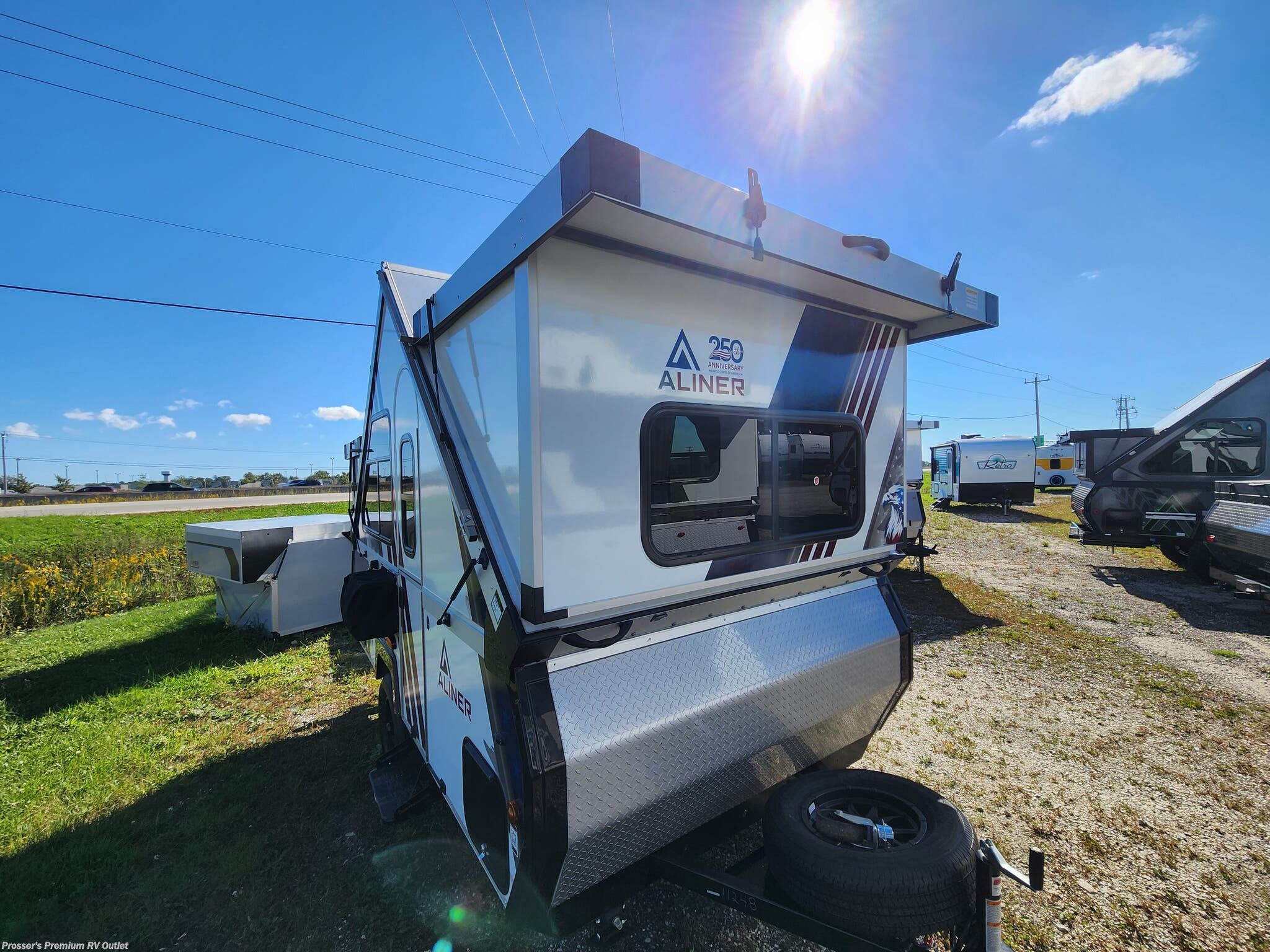 2027 Aliner Ranger 12 REAR SOFA - New Expandable Trailer For Sale by Prosser's Premium RV Outlet in Sturtevant, Wisconsin features Microwave, Water Heater, Stove Top Burner, Refrigerator