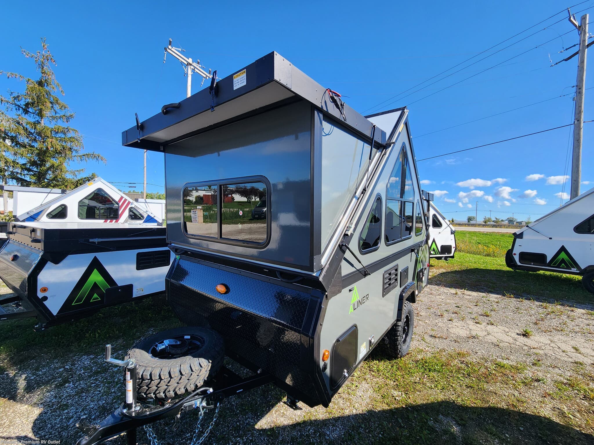 2027 Aliner Evolution 12 - New Popup For Sale by Prosser's Premium RV Outlet in Sturtevant, Wisconsin features Bike Rack, Heat Pump, Stabilizer Jacks, Stove, Furnace