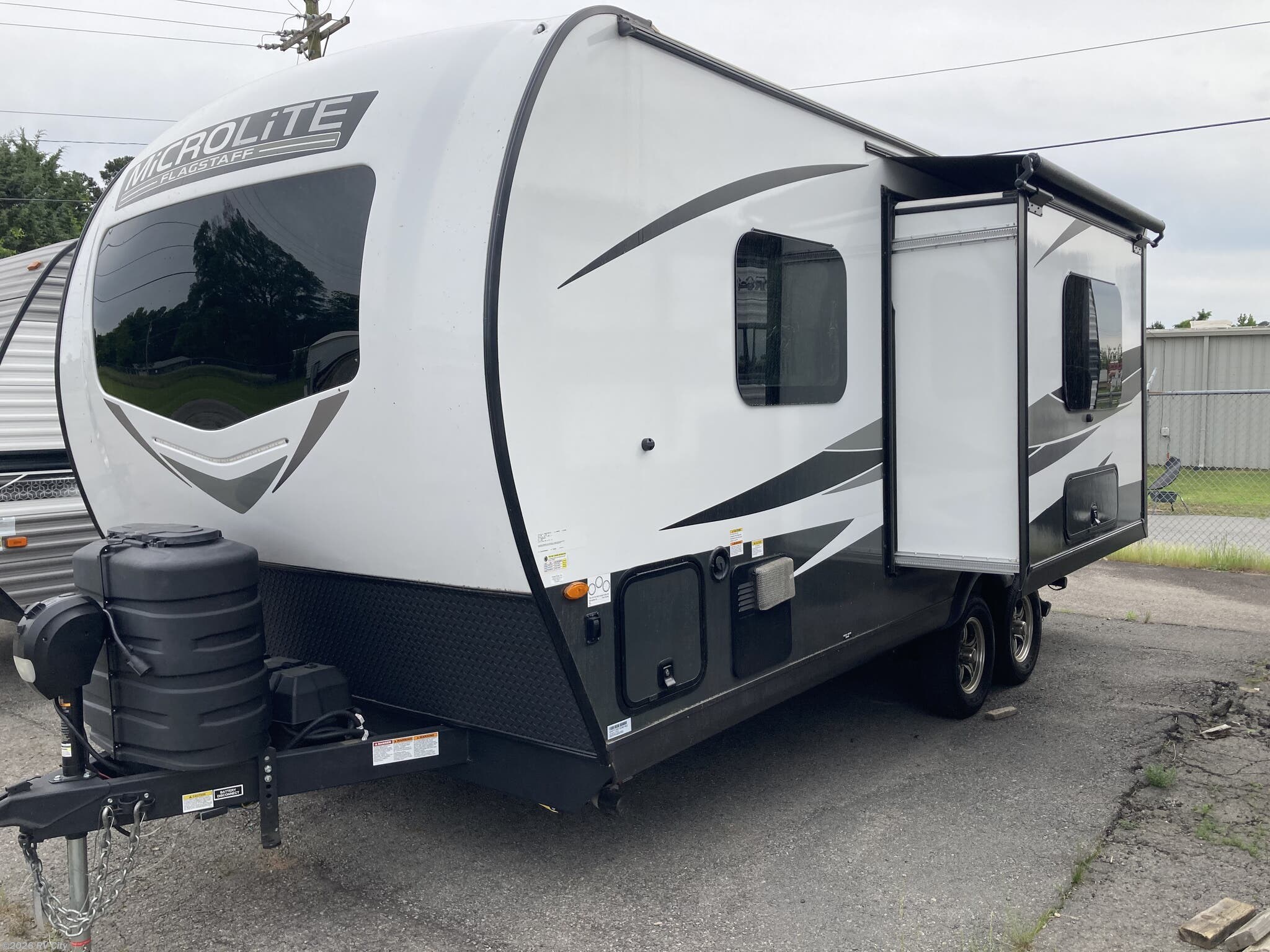 2025 Forest River Flagstaff Micro Lite 21FBRS - Used Travel Trailer For Sale by RV City in Benton, Arkansas features Kitchen Sink, Stabilizer Jacks, Fireplace, Black Tank Flush, Water Heater