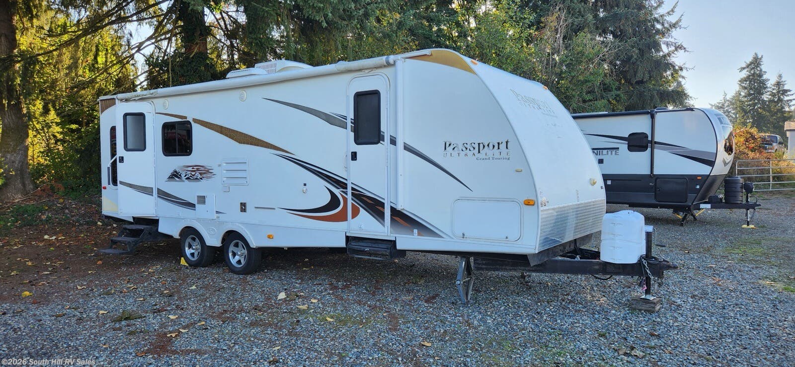 2012 Keystone Passport Ultra Lite 2850RL - Used Travel Trailer For Sale by South Hill RV Sales in Puyallup, Washington features Microwave, Oven, Stove, Water Heater, Awning