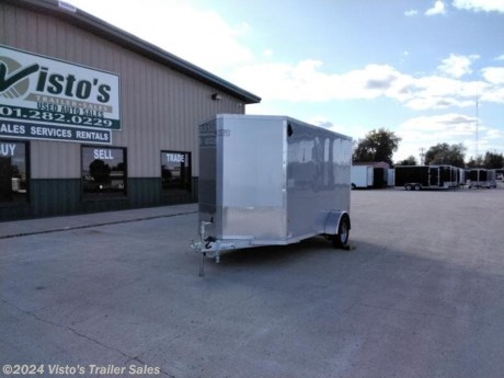 Check out this New EZ Hauler 6&#39;X12&#39; Enclosed Trailer from Visto&#39;s Trailer Sales in West Fargo, ND. Stock #025486

Standard Features:-3,500lb Spring Axle-2&quot; Coupler-Screwless Exterior-32&quot; Side Door-Rear Ramp Door

Upgrades Added:-6.5&#39; Interior Height

*MAY BE SHOWN W/ OPTIONAL SPARE AND CARRIER*

Visto&#39;s Trailer Sales not only offers trailer sales and truck beds, but also provides parts and service support. We&#39;re here to provide you with full support for your trailer needs.

Don&#39;t forget to shop our Parts department or ask our expert sales team about recommendations or upgrades fit for your trailer, such as spare tires, mounts, toolboxes, and more. We&#39;re here to make your hauling experience easier and more efficient! 

Did you know we offer custom trailer design and ordering? Our trailer sales team will work with you to find the best option fit for your hauling needs. Give us a call at 701-282-0229 to speak with our sales team, or stop by our dealership in West Fargo, ND to see our trailer inventory in person.