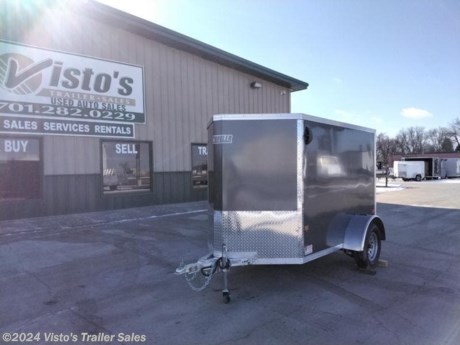 Check out this New EZ Hauler 5&#39;X8&#39; Enclosed Trailer from Visto&#39;s Trailer Sales in West Fargo, ND. Stock # 028049 

Standard Features:-3500lb Spring Axles-2&#39;&#39; Coupler-Rear Ramp Door-5&#39; Interior Height-All Aluminum Construction-One Piece Roof-LED Lighting-24&#39;&#39; Stoneguard-Screwless Exterior-Side Door w/Flush Lock-16&#39;&#39; O/C Walls-3/8&#39;&#39; Water Resistant Interior Walls-24&#39;&#39; V-Nose

*MAY BE SHOWN W/ OPTIONAL SPARE AND CARRIER*

Visto&#39;s Trailer Sales not only offers trailer sales and truck beds, but also provides parts and service support. We&#39;re here to provide you with full support for your trailer needs.

Don&#39;t forget to shop our Parts department or ask our expert sales team about recommendations or upgrades fit for your trailer, such as spare tires, mounts, toolboxes, and more. We&#39;re here to make your hauling experience easier and more efficient! 

Did you know we offer custom trailer design and ordering? Our trailer sales team will work with you to find the best option fit for your hauling needs. Give us a call at 701-282-0229 to speak with our sales team, or stop by our dealership in West Fargo, ND to see our trailer inventory in person.