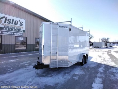 Check out this New Haulmark V-Front Grizzly HD 7&#39;X16&#39; Enclosed Trailer from Visto&#39;s Trailer Sales in West Fargo, ND. Stock #414641

Standard Features:-(2) 5,200lb Torsion Axles with Electric Brakes-Steel Frame-2 5/16&quot; Adjustable Coupler-16&quot; OC Crossmembers-8,000lb Jack-48&quot; A Frame with Center Draw Bar-ArmorTech Coating on A Frame-3/4&quot; PlexCore Decking-3/8&quot; PlexCore Sidewall Liner-(4) 5,000lb D Rings-(2) 12V LED Dome Lights-LED Lights-Polished Aluminum Front Corners and Cap-Bonded Exterior Sidewalls-24&quot; ATP Stoneguard-Sidewall Vents

Upgrades Added:-Ramp Extension-Spoiler-7&#39; Height-Removable Aluminum Ladder-3 piece Ladder Rack

*MAY BE SHOWN W/ OPTIONAL SPARE AND CARRIER*

Visto&#39;s Trailer Sales not only offers trailer sales and truck beds, but also provides parts and service support. We&#39;re here to provide you with full support for your trailer needs.

Don&#39;t forget to shop our Parts department or ask our expert sales team about recommendations or upgrades fit for your trailer, such as spare tires, mounts, toolboxes, and more. We&#39;re here to make your hauling experience easier and more efficient! 

Did you know we offer custom trailer design and ordering? Our trailer sales team will work with you to find the best option fit for your hauling needs. Give us a call at 701-282-0229 to speak with our sales team, or stop by our dealership in West Fargo, ND to see our trailer inventory in person.