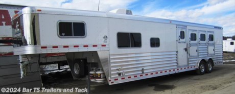 &lt;span style=&quot;font-family: Arial, Helvetica, sans-serif; font-size: 16px;&quot;&gt;Over $8000 OFF on this gorgeous trailer with&amp;nbsp;12&#39;8&quot; spacious living quarters done by Trail Boss Interiors.&lt;/span&gt;
&lt;p&gt;&lt;span style=&quot;font-family: Arial, Helvetica, sans-serif; font-size: 16px;&quot;&gt;&lt;span style=&quot;font-weight: bold; font-size: 16px;&quot;&gt;Standard Features&lt;/span&gt;&lt;br /&gt;
		- All Aluminum&amp;nbsp;&lt;br /&gt;
		- 7000# Torsion Axles&amp;nbsp;&lt;br /&gt;
		- 8 hole Steel mod wheels&amp;nbsp;&lt;br /&gt;
		- LT235/85R16 LR &quot;E&quot; 10 ply tires&lt;br /&gt;
		- Aluminum slats &amp;amp; fenders w/ white skin &amp;amp; stainless steel on
nose&amp;nbsp;&lt;br /&gt;
		&lt;br /&gt;
		&lt;span style=&quot;font-weight: bold; font-size: 16px;&quot;&gt;Horse Area&lt;/span&gt;&amp;nbsp;&lt;br /&gt;
		- Drop down doors w/drop down bars on head side, windows butt side&amp;nbsp;&lt;br /&gt;
		- Escape door at 1st stall w/drop down feed door&lt;br /&gt;
		- 3 mangers w/3 access doors&amp;nbsp;&lt;br /&gt;
		- Stud divider at 1st stall&lt;br /&gt;
		- Collapsible rear tack&lt;br /&gt;
		- 3 blanket bars on swing out rack&lt;br /&gt;
		- 4 saddle racks on removable post&lt;br /&gt;
		- 2 brush trays&lt;br /&gt;
		- 10 bridle hooks&lt;br /&gt;
		- 4 roof vents&lt;br /&gt;
		- Fully double walled &amp;amp; insulated&lt;br /&gt;
		- Rubber lined, &amp;amp; padded&lt;br /&gt;
		- Double rear doors with cam locks&lt;br /&gt;
		- LED load light at rear&lt;br /&gt;
		- Spare tire&lt;br /&gt;
		- Axles are blocked 2&quot; for holding tank clearance&lt;br /&gt;
		- Gooseneck lowered for more bed area clearance&lt;br /&gt;
		- Dual propane tanks&lt;br /&gt;
		- Dual battery aluminum box w/1 battery wired in&lt;br /&gt;
		- Equalizer electric/hydraulic jack&lt;br /&gt;
		- 10 ply tires.&lt;br /&gt;
		- Skinned hay rack and ladder&lt;br /&gt;
		- Top rail: welded one piece gussets 3/16” thickness&amp;nbsp;&lt;br /&gt;
		- Rear frame is supported by a 21/2” x 5” upper header up to a 1/4” thick&lt;br /&gt;
		- Top Rail: 5” radius rail with an overall height of 8” and a material
thickness of 3/16”&lt;br /&gt;
		- Roof Construction: The Elite roof is constructed with 1” x 21/2” posts
strategically placed to ensure maximum strength - arched to keep water from
standing on the roof,&amp;nbsp;producing a taut roof sheet and allows for more head
room in the center of the trailer. Elite’s one piece roof sheet is made of 3003
H16 aluminum and at .040&amp;nbsp;thick is 25% thicker than the roof sheet used by
most other manufacturers.&lt;br /&gt;
		Bottom rail: Height of 9 1/2”, and a thickness of 3/16”, Elite’s bottom rail is
one of the biggest in the industry.&amp;nbsp;&lt;br /&gt;
		Flooring: Elite’s horse trailer floor structure consists of 4” I – Beams on 12”
centers. The I – Beam is 4” in height with an upper 21/2” flange that is welded
o the floor and a lower 3” flange that is welded to the bottom rail. Elite
utilizes a 5052 marine grade sheet floor on top of the structure to provide
longer lasting&amp;nbsp;protection against corrosive factors such as horse or
livestock urine. The seams and perimeter are welded out to add strength and
ensure against leakage.&lt;br /&gt;
		- LED Lighting throughout&amp;nbsp;&lt;/span&gt;&lt;/p&gt;
&lt;p&gt;&lt;span style=&quot;font-family: Arial, Helvetica, sans-serif; font-size: 16px;&quot;&gt;&lt;span style=&quot;font-weight: bold; font-size: 16px;&quot;&gt;Living Quarters - 12&#39;8&quot;&lt;/span&gt;&lt;br /&gt;
		- Trail Boss Custom L.Q&lt;br /&gt;
		- Double insulation&lt;br /&gt;
		- Alder cabinets&lt;br /&gt;
		- Crown moldings throughout&lt;br /&gt;
		- Solid wood window frames&lt;br /&gt;
		- Soft touch walls &amp;amp; ceiling&lt;br /&gt;
		-&amp;nbsp;72&quot;x60&quot; L shaped deluxe sofa/sleeper w/table&lt;br /&gt;
		- Overhead Cabinets above sofa&lt;br /&gt;
		- Designer linoleum floor&lt;br /&gt;
		- 6.0 CU FT refrigerator&lt;br /&gt;
		- 1.7 cu.ft. microwave oven&lt;br /&gt;
		- Flush mount 2-burner cook top&lt;br /&gt;
		- Stainless kitchen sink&lt;br /&gt;
		- Ducted air conditioner&lt;br /&gt;
		- Ducted furnace&lt;br /&gt;
		- Pleated shades&lt;br /&gt;
		- Upgraded valances&lt;br /&gt;
		- Shirt closets for tons of storage in bed area&lt;br /&gt;
		- Queen size mattress&lt;br /&gt;
		- Hot water heater&lt;br /&gt;
		- AM/FM/CD/DVD stereo with interior &amp;amp; exterior speakers&lt;br /&gt;
		- Full TV Cabinet w/22&quot; Built In LCD TV
w/DVD and swing arm&lt;br /&gt;
		- Systems monitor&lt;br /&gt;
		- Pocket door to bathroom&lt;br /&gt;
		- Porcelain toilet&lt;br /&gt;
		- Radius shower w/sliding door&lt;br /&gt;
		- Skylight over shower&lt;br /&gt;
		- Fantastic vent w/power dome&lt;br /&gt;
		- Full length mirror&lt;br /&gt;
		- Vanity sink w/medicine cabinet&lt;br /&gt;
		- Large hanging closet&amp;nbsp;&lt;br /&gt;
		- Walk thru door to horse area&amp;nbsp;&lt;br /&gt;
		- Porch light&lt;br /&gt;
		- LED exterior grab handle&lt;br /&gt;
		- Fold up step&lt;br /&gt;
		- Electric awning&amp;nbsp;&lt;br /&gt;
		- 40 gal. fresh water tank&lt;br /&gt;
		- 30 gal. gray/black holding tanks&lt;br /&gt;
		- 12v. on demand water pump&lt;br /&gt;
		- Sewer hose and carrier&lt;br /&gt;
		- Exterior water faucet&lt;br /&gt;
		- Gas, CO, smoke detector&lt;br /&gt;
		- Fire extinquisher&lt;br /&gt;
		- Battery disconnect switch&lt;br /&gt;
		- 55 amp converter&lt;br /&gt;
		- Wall sconces&lt;br /&gt;
		- Exterior receptacle&lt;br /&gt;
		- 12v. reading lights, high intensity lighting&lt;/span&gt;&lt;/p&gt;
&lt;p&gt;&lt;span style=&quot;font-family: Arial, Helvetica, sans-serif; font-size: 16px;&quot;&gt;&amp;nbsp;&lt;/span&gt;&lt;/p&gt; 
