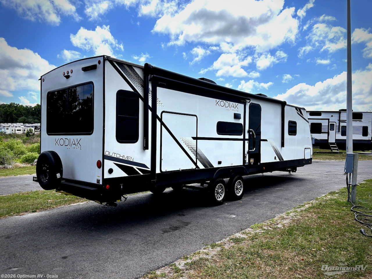 2025 Dutchmen Kodiak Ultimate 3221RLSL - New Travel Trailer For Sale by Optimum RV - Ocala in Ocala, Florida features Awning, Slideout