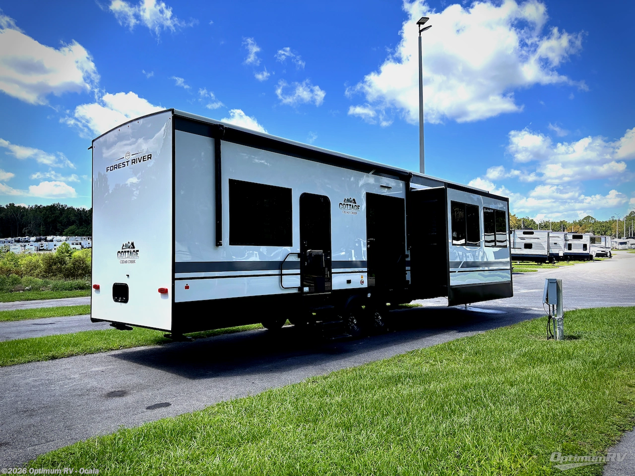 2027 Forest River Cedar Creek Cottage 40CCK - New Destination Trailer For Sale by Optimum RV - Ocala in Ocala, Florida features Slideout, Awning