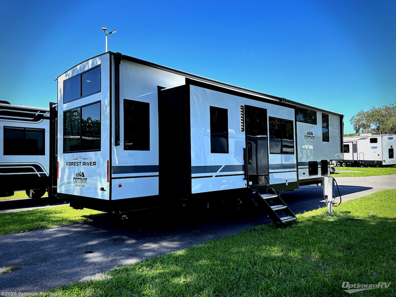 2027 Forest River Cedar Creek Cottage 412FWC - New Destination Trailer For Sale by Optimum RV - Ocala in Ocala, Florida features Slideout