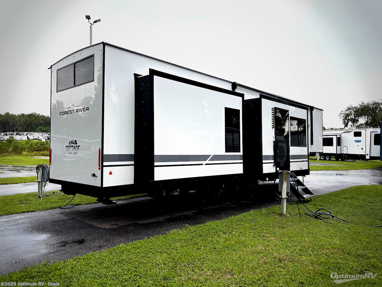 2027 Forest River Cedar Creek Cottage 413FWC - New Destination Trailer For Sale by Optimum RV - Ocala in Ocala, Florida features Slideout
