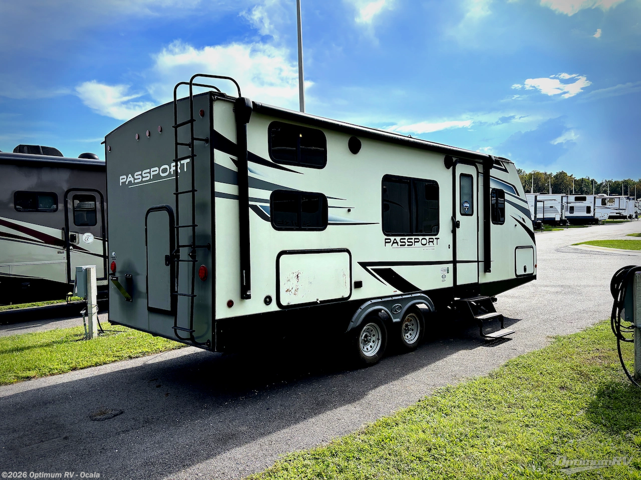2021 Keystone Passport 219BH SL Series - Used Travel Trailer For Sale by Optimum RV - Ocala in Ocala, Florida features Awning