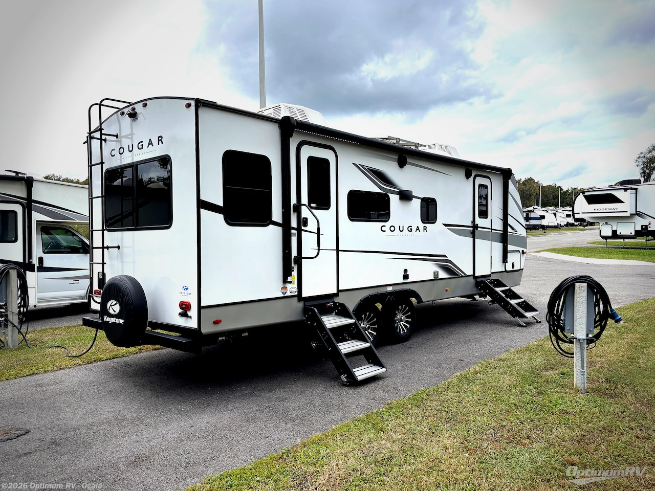 2023 Keystone Cougar Half-Ton 25RDS - Used Travel Trailer For Sale by Optimum RV - Ocala in Ocala, Florida features Awning, Slideout