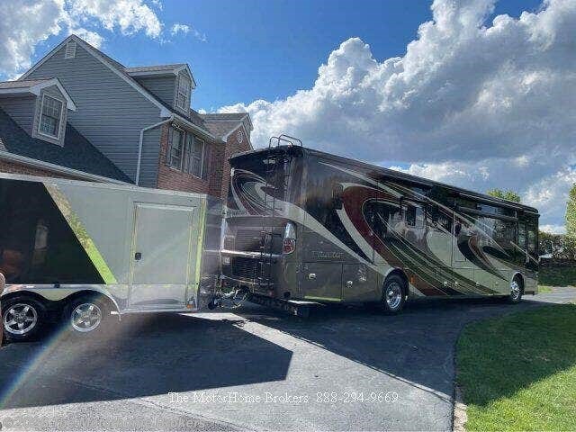 2015 Tiffin Phaeton 40 QBH - Used Class A For Sale by The Motorhome Brokers in Salisbury, Maryland features Shower, Slide-out Battery Tray, Hydronic Heat, Bath & 1/2, Glass Shower Door