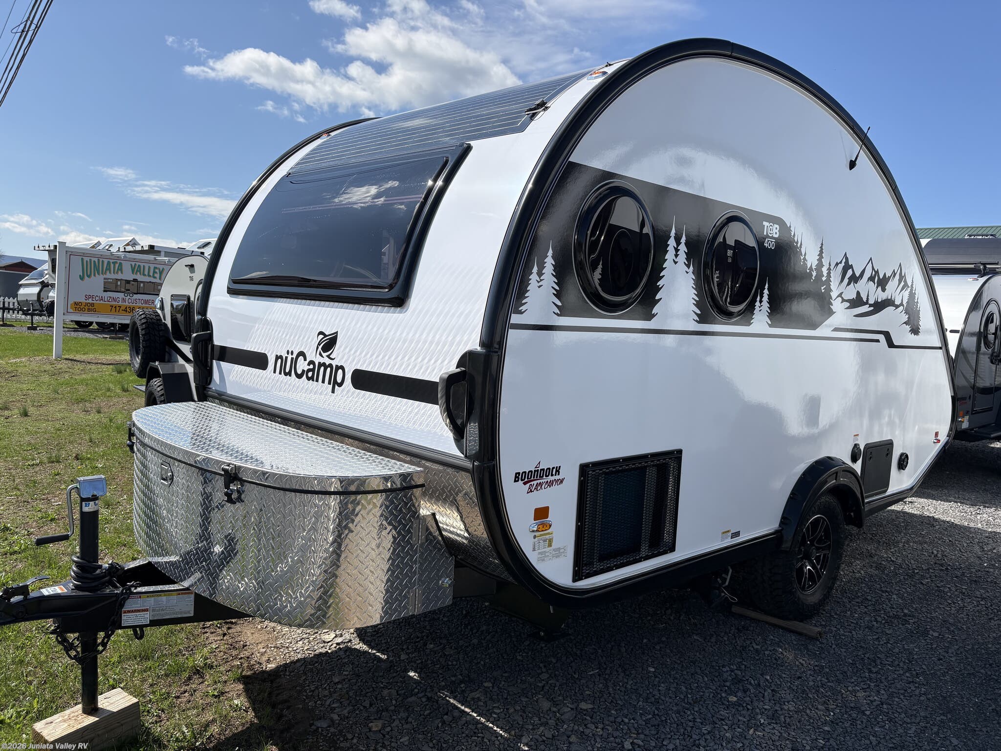 2026 NuCamp TAB 400 Black Canyon - New Teardrop Trailer For Sale by Juniata Valley RV in Mifflintown, Pennsylvania features Power Roof Vent, Stove Cover, Dinette, Converter, Sewer Hose & Carrier