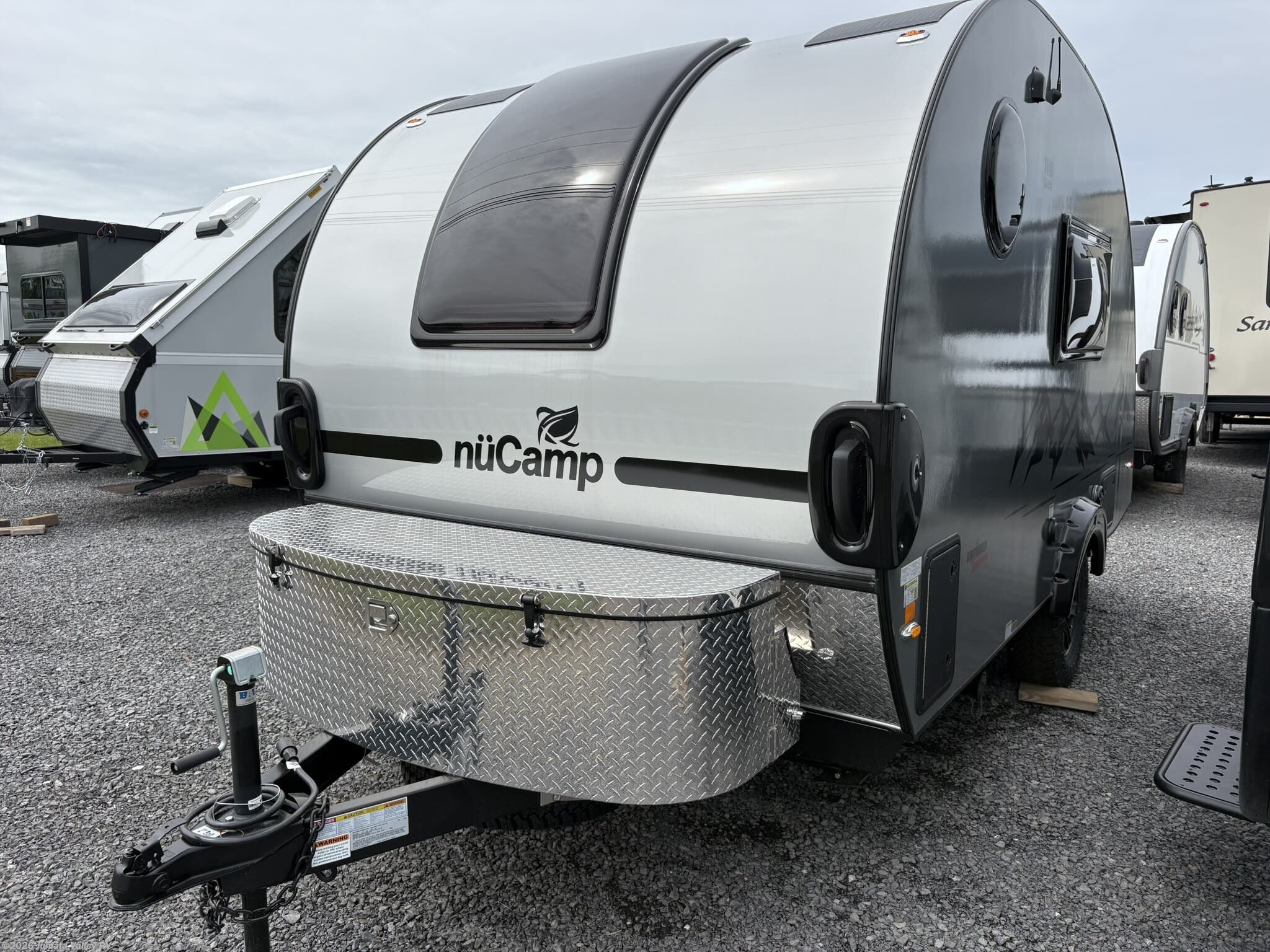 2026 NuCamp TAB 360 CS Black Canyon - New Teardrop Trailer For Sale by Juniata Valley RV in Mifflintown, Pennsylvania features Heated Water Tank, Stove Top Burner, Pleated Shades, Propane, Bluetooth Stereo