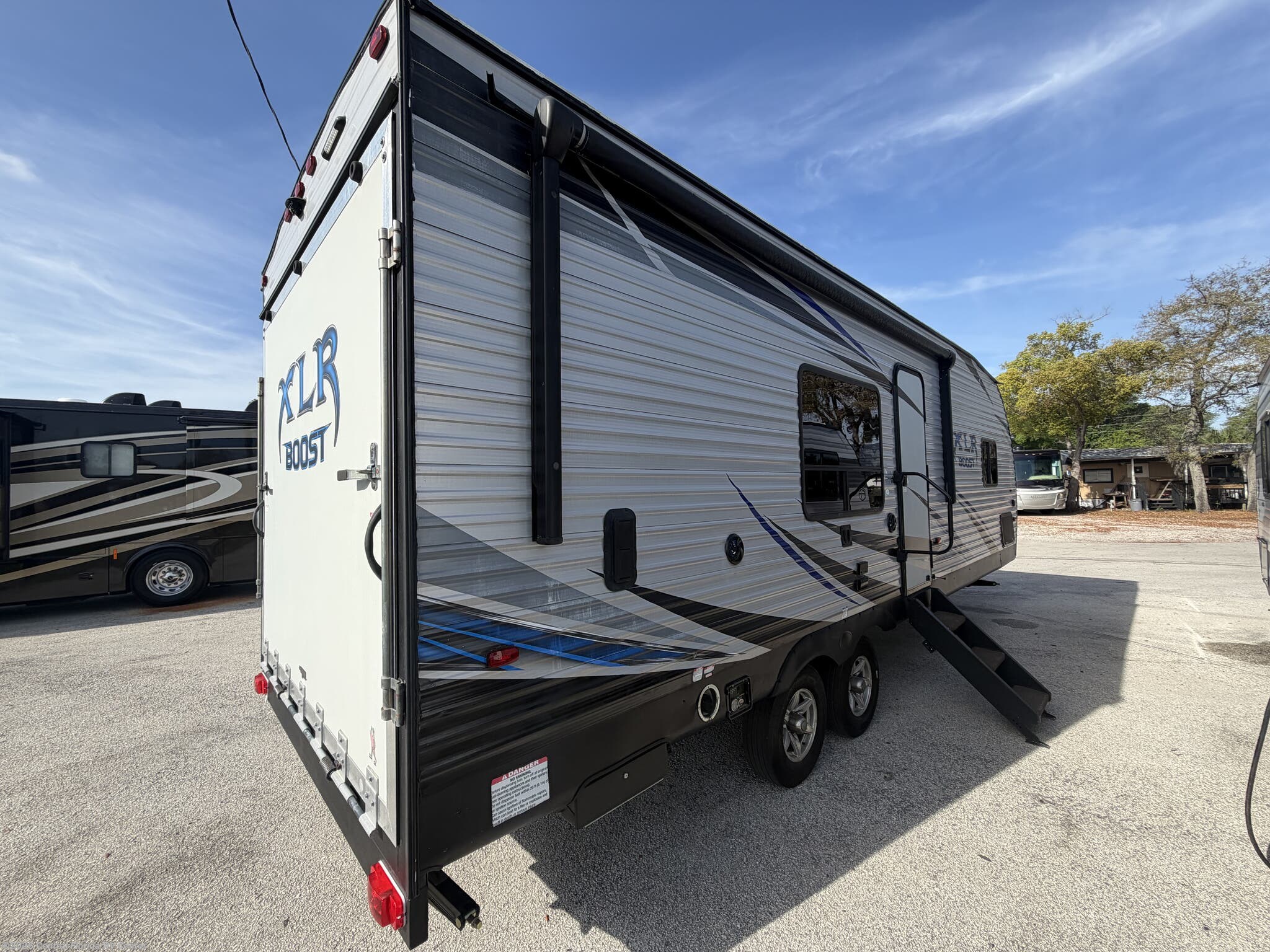 2018 Forest River XLR Boost 27QB - Used Travel Trailer For Sale by Central Florida RV Center in Apopka, Florida features TV, Refrigerator, Air Conditioning, Fire Extinguisher, Stove Top Burner