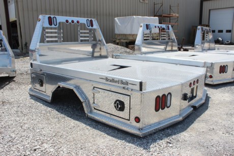 NEW ALUMINUM SKIRTED FLATBED FOR TRUCK. BRADFORD BUILT 96&amp;quot; X 112&amp;quot; ALUMINUM 4 BOX UTILITY BED, LED LIGHTS, LIGHTED HEADACHE RACK, GOOSENECK HITCH AND 2-1/2&amp;quot; REAR RECEIVER HITCH, 4 TOOLBOXES (ONE IN EACH CORNER), 4&amp;quot; FOLD DOWN SIDES, TAPERED REAR CORNERS, 60&amp;quot; CAB TO AXLE, 34&amp;quot; FRAME WIDTH, FITS CAB AND CHASSIS DUALLY TRUCK (9FT FRAME). Please check with us for exact fitment as makes vary slightly.

Type: Truck body