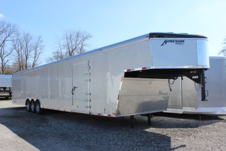 2023 HOMESTEADER 8.5  X 48  HERCULES GOOSENECK ENCLOSED CARGO TRAILER, GOOSENECK VEE-NOSE, 2 SPEED DUAL LANDING GEER, 84  INTERIOR HEIGHT, 3-7K TORSION AXLES, ELECTRIC BRAKES, ST235/80R16  TIRES, SILVER MOD WHEELS, MATCHING SPARE TIRE, SPARE TIRE COMPARTMENT, .030 SILVER MIST ALUMINUM EXTERIOR, CHROME FRONT CORNERS, POLISHED ALUM REAR FRAMEWORK, DOUBLE REINFORCED REAR RAMP DOOR WITH EXTENDED WOOD FLAP, 48  SIDE DOOR WITH BAR LOCK, ADDITIONAL DOOR HINGE, KEYED LOCKABLE DOOR HASPS, BOGEY WHEELS (PAIR), 4 FOOT BEAVER TAIL, 3/4  PLYWOOD FLOOR, 3/8  PLYWOOD WALLS, (12) RECESSED FLOOR MOUNT 5000# D-RINGS, (5) 12V LED INTERIOR DOME LIGHTS, 12V INTERIOR WALL SWITCH, REAR LOADING LIGHT, DOUBLE LED TAILLIGHTS, BACK-UP LIGHTS, (10) ADDITIONAL LED CLEARANCE LIGHTS, FLOW THRU VENTS (PAIR), 12  ON CENTER ROOF BOWS, WALL POSTS, AND FLOOR CROSSMEMBERS, WINCH PLATE, 3 YEAR LIMITED STRUCTURAL WARRANTY.