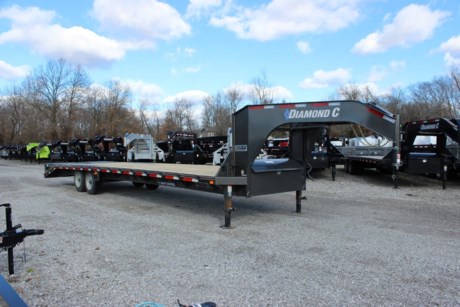 2023 DIAMOND C 32  ENGINEERED BEAM GOOSENECK FLATDECK TRAILER, 5  DOVETAIL WITH 2 FLIP OVER MONSTER RAMPS(44  WIDE, SPRINGLOADED), 2-8K HYD/DISC BRAKE / OIL BATH AXLES, SPRING SUSPENSION, ST215/75R17.5  16 PLY TIRES, SPARE TIRE IN NECK, 2-5/16  BULLDOG ADJUSTABLE GN COUPLER, 2-12K DROP LEG JACKS, RETRACTABLE FRONT DECK STEPS, MID-DECK STEP ON BOTH SIDES, FRONT TOOLBOX BETWEEN GN RISERS, TREATED WOOD FLOOR, 5  CHANNEL LACE RAIL, 3  CHANNEL CROSS-MEMBERS ON 16  CENTERS, RUB RAIL WITH STAKE-POCKETS AND PIPE-SPOOLS, 16  TALL ENGINEERED I-BEAM, CAMBERED DECK AND FRAME, APPROXIMATELY 34  DECK HEIGHT, 102  OVERALL WIDTH, SEALED WIRING HARNESS, LED LIGHTS, GREY METALLIC DM POWDERCOAT, FLOOD LIGHTS, EXTRA CLEARANCE LIGHTS, PASSENGERS SIDE SLIDE TRACK, 3 YEAR STRUCTURE WARRANTY.