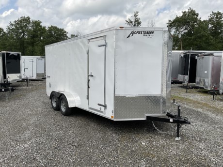 2024 HOMESTEADER 7&#39; X 16&#39; ENCLOSED CARGO TRAILER, V-NOSE WITH FRONT STONEGUARD, 78&quot; INTERIOR HEIGHT, WHITE ALUMINUM EXTERIOR, 2-3.5K ELECTRIC BRAKE AXLES, SPRING SUSPENSION, 15&quot; RADIAL TIRES, 32&quot; SIDE DOOR WITH BAR LOCK, REAR RAMP DOOR WITH EXTENDED WOOD FLAP, 3/4&quot; PLYWOOD FLOOR, 3/8&quot; PLYWOOD WALLS, 16&quot; ON CENTER FLOOR CROSSMEMBERS AND WALL POSTS, (4) FLOOR MOUNT D-RINGS, FLOW THRU VENTS - SIDEWALL, DOME LIGHT, LED EXTERIOR LIGHTS, 2-5/16&quot; COUPLER, A-FRAME JACK.