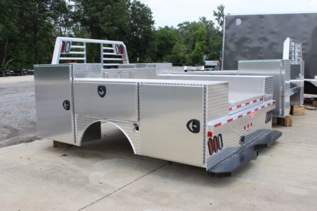 New Zimmerman Aluminum Advantage Service Body. ONE SHELF LEFT FRONT BOX, SHELVES REAR BOX (1-LEFT AND 1-RIGHT), 3&quot; DRAWERS FRONT RIGHT BOX (X3). B&amp;W GN HITCH (DOUBLE CHECK TRAILER TONGUE HEIGHT AS NOT TO GET INTO SIDE BOXES). You can pull a gooseneck trailer with this service body with the built in B&amp;W gooseneck hitch! Has a HD full width step bumper with rear 2-1/2&quot; receiver hitch as well. Get all the Advantages of a service body AND a gooseneck flatbed in one rust free package! This bed fits a dually rear wheel pickup cab and chassis (9&#39; frame) Ford, Dodge, or GM. Comes with a few drawers and shelves and we can add as many as you like in any box! Smooth aluminum doors allow you to add your own decals to the sides! Lockable toolboxes. LED rear tail lights and lighted headache rack with clearance lights all around. (4) floor mount d-rings. Ladder racks, toolbox lights and other options are available. Add this amazing one of a kind Service body to your truck today! We can install it in about 6 hours while you wait and have a courtesy vehicle for your use during the install!