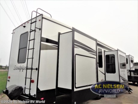 &lt;p&gt;&lt;strong&gt;Forest River Sandpiper Luxury fifth wheel 379FLOK highlights:&lt;/strong&gt;&lt;/p&gt; &lt;ul&gt; &lt;li&gt;Separate Living Room&lt;/li&gt; &lt;li&gt;Dual Entry&lt;/li&gt; &lt;li&gt;Outdoor Kitchen&lt;/li&gt; &lt;li&gt;Six Slides&lt;/li&gt; &lt;li&gt;Two Hide-A-Bed Sofas&lt;/li&gt; &lt;/ul&gt; &lt;p&gt;&#160;&lt;/p&gt; &lt;p&gt;There is an enormous amount of space in this Sandpiper Luxury fifth wheel because of the six slides! You&#39;ll have plenty of room to sit down on the &lt;strong&gt;theater seating&lt;/strong&gt; or tri-fold sofas in the living room, and you&#39;ll also be able to move around easily in the kitchen as you use the four-burner range to prepare dinner and the &lt;strong&gt;kitchen island&lt;/strong&gt; to wash dishes afterwards. Since the &lt;strong&gt;private bedroom&lt;/strong&gt; and full bathroom are in the back of this unit on the main deck, you&#39;ll have ample headroom to live comfortably. Another accommodating feature is the &lt;strong&gt;ceiling fan&lt;/strong&gt;. With the fan sitting above the kitchen, you&#39;ll be able to use it when the air gets too stuffy from whatever is cooking on the range.&lt;/p&gt; &lt;p&gt;&#160;&lt;/p&gt; &lt;p&gt;When a brand claims to be luxurious, you expect true luxury, and the Forest River Sandpiper Luxury fifth wheel delivers! The list of included features is outstanding, and the construction itself is top notch. Everything comes together on a welded aluminum-framed, vacuum-bonded laminated superstructure and a cambered powder-coated frame with rust prohibitor. There is a fully enclosed, heated underbelly and an &lt;strong&gt;unobstructed drop-frame pass-through&lt;/strong&gt; storage area with cable jacks and 110V outlet. Two LED-lit exterior speakers add some fun to the outside, and the docking station includes easy winterization, hot and cold spray port, black tank flush, and pull valves for tanks. But the true luxury is found inside with the 84&quot; interior height, &lt;strong&gt;residential countertops&lt;/strong&gt;, recessed residential lighting, &lt;strong&gt;extra-large picture windows&lt;/strong&gt;, LED-lit headboard, and &lt;strong&gt;premium sound bar&lt;/strong&gt; with built-in flush-mount DVD player. Each unit has also been prepped for a washer/dryer so that you can extend every trip and make your Sandpiper Luxury feel more like home.&lt;/p&gt;&lt;ul&gt;&lt;li&gt;Front Living&lt;/li&gt;&lt;li&gt;Two Entry/Exit Doors&lt;/li&gt;&lt;li&gt;Outdoor Kitchen&lt;/li&gt;&lt;li&gt;Kitchen Island&lt;/li&gt;&lt;li&gt;Front Entertainment&lt;/li&gt;&lt;li&gt;Rear Bedroom&lt;/li&gt;&lt;/ul&gt;&lt;ul&gt;&lt;li&gt;2022 PLATINUM PACKAGE&lt;/li&gt;&lt;li&gt; 2022 SIGNATURE PACKAGE&lt;/li&gt;&lt;li&gt; CENTRAL VACUUM&lt;/li&gt;&lt;li&gt; MAXX AIR FAN W/RAIN SENSOR IN KITCHEN&lt;/li&gt;&lt;li&gt; NEBRASKA STATE SEAL&lt;/li&gt;&lt;li&gt; WASHER AND DRYER&lt;/li&gt;&lt;/ul&gt;