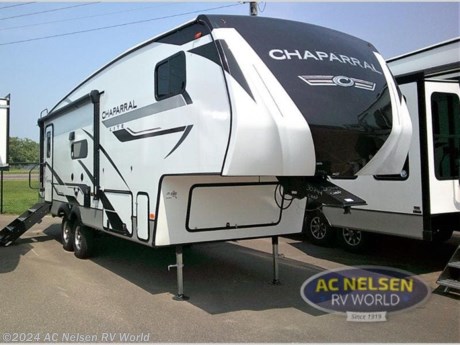 &lt;p&gt;&lt;strong&gt;Coachmen RV Chaparral Lite fifth wheel 25RE highlights:&lt;/strong&gt;&lt;/p&gt; &lt;ul&gt; &lt;li&gt;Entertainment Center&lt;/li&gt; &lt;li&gt;Front Private Bedroom&lt;/li&gt; &lt;li&gt;Full Bathroom&lt;/li&gt; &lt;li&gt;Theater Seating&lt;/li&gt; &lt;li&gt;Outside Shower&lt;/li&gt; &lt;/ul&gt; &lt;p&gt;&#160;&lt;/p&gt; &lt;p&gt;Head to your favorite destinations with your favorite person in this fifth wheel! The front private bedroom has a &lt;strong&gt;residential queen bed&lt;/strong&gt; with a pillowtop mattress, dual nightstands, and overhead storage for your belongings. Freshen up each morning in the full bathroom with the &lt;strong&gt;large shower&lt;/strong&gt; with sliding glass doors and a seat, and there is an LED motion sensor light for nighttime use.&#160;You can prepare your best home cooked meals with 21&quot; stainless steel oven with a &lt;strong&gt;residential cooktop&lt;/strong&gt;, and there is an extra deep single basin sink for easy clean up. Eat your meals comfortably at the &lt;strong&gt;booth dinette&lt;/strong&gt; and then relax in the theater seating while you enjoy the entertainment center which has a closet next to it for your storage needs!&lt;/p&gt; &lt;p&gt;&#160;&lt;/p&gt; &lt;p&gt;Comfort, convenience, and an easy haul is what you will find with each one of these Coachmen RV Chaparral Lite fifth wheels! Their Tri-Tex powder coated frame technology is up to 5X more weather resistant, and the dual-sided &lt;strong&gt;Azdel composite sidewall panels&lt;/strong&gt; is ultra durable. The &lt;strong&gt;Road Armor suspension&lt;/strong&gt; by Trail Air comes with heavy duty shackles and wet bolts so you can be sure it will hold up through every adventure, and you might want to add the Furrion exterior back-up and sideview camera prep for easy parking. You will feel right at home inside with roller night shades,&lt;strong&gt; Thomas Payne furniture&lt;/strong&gt;, a high BTU output modern electric fireplace, and many more comforts! The exterior is just as inviting with its electric awning with LED lights, &lt;strong&gt;Solid Step entry steps&lt;/strong&gt;, and pass-through storage for all your gear!&lt;/p&gt;&lt;ul&gt;&lt;li&gt;Front Bedroom&lt;/li&gt;&lt;/ul&gt;&lt;ul&gt;&lt;li&gt;10 CU FT REFER IPO 8 CU FT REFER&lt;/li&gt;&lt;li&gt; 2&quot; RECEIVER HITCH ACCESSORY&lt;/li&gt;&lt;li&gt; 4-PT ELEC. AUTO LEVELING&lt;/li&gt;&lt;li&gt; 50&quot; LED TELEVISION&lt;/li&gt;&lt;li&gt; CHAPARRAL LITE PACKAGE&lt;/li&gt;&lt;li&gt; COMFORT AIR FAN (KITCHEN ONLY)&lt;/li&gt;&lt;li&gt; ELECTRONIC HEATED HOLDING TANKS&lt;/li&gt;&lt;li&gt; FREE STANDING TABLE &amp; 4 CHAIRS&lt;/li&gt;&lt;li&gt; NEBRASKA STATE SEAL&lt;/li&gt;&lt;li&gt; ROADSIDE ASSISTANCE&lt;/li&gt;&lt;li&gt; ROOF MOUNTED SOLAR PANEL&lt;/li&gt;&lt;li&gt; TRI-FOLD SOFA IPO THEATER SEATING&lt;/li&gt;&lt;/ul&gt;