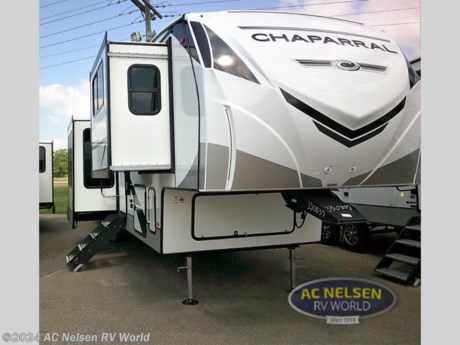 &lt;p&gt;&lt;strong&gt;Coachmen RV Chaparral Mid-Profile fifth wheel 334FL&#160;highlights:&lt;/strong&gt;&lt;/p&gt; &lt;ul&gt; &lt;li&gt;Five Slides&lt;/li&gt; &lt;li&gt;Kitchen Island&lt;/li&gt; &lt;li&gt;Shower with a Seat&lt;/li&gt; &lt;li&gt;Queen Bed&lt;/li&gt; &lt;li&gt;20&#39; Power Awning with LED Lights&lt;/li&gt; &lt;/ul&gt; &lt;p&gt;&#160;&lt;/p&gt; &lt;p&gt;Camping or full-timing in this spacious fifth wheel will make the whole family happy. Your crew will love to visit in the front living area that included &lt;strong&gt;two tri-fold hide-a-bed sofas&lt;/strong&gt;, theatre seating with a side table, plus an entertainment center for an optional 50&quot; LED TV.&#160; The kitchen is any chef&#39;s dream with its kitchen island, &lt;strong&gt;residential pantry,&lt;/strong&gt; plus a second pantry, and stainless steel appliances. And the free-standing table will allow you to dine just like you do at home. Head to the master suite to find a queen bed slide out with a &lt;strong&gt;king bed option&lt;/strong&gt;, two dressers, plus a full rear bath with&lt;strong&gt;&#160;dual bath sinks!&lt;/strong&gt;&lt;/p&gt; &lt;p&gt;&#160;&lt;/p&gt; &lt;p&gt;Each Chaparral mid-profile fifth wheel by Coachmen is designed with residential features, loads of storage space, and roomy bedroom suites to make you feel right at home. The durable construction means you can enjoy your RV for years to come. There&#39;s dual-sided &lt;strong&gt;Azdel composite sidewall panels&lt;/strong&gt;, Weather Shield+ technology, and Tri-Tex powder coated frame technology that will allow you to camp year around. Each model includes a &lt;strong&gt;Winegard Air 360&lt;/strong&gt; HDTV/radio dome antenna and an AM/FM/CD/DVD player with Bluetooth to keep your entertained, plus &lt;strong&gt;roller night shades&lt;/strong&gt; and a modern electric fireplace to make your space cozy. There is also a large transom window in the kitchen, a modern high-rise faucet, LED motion sensor lights in the bathroom, plus a &lt;strong&gt;full-size shower&lt;/strong&gt; with glass doors and a seat. Now that&#39;s what I call luxury! Choose a Chaparral fifth wheel today!&lt;/p&gt;&lt;ul&gt;&lt;li&gt;Front Living&lt;/li&gt;&lt;li&gt;Rear Bath&lt;/li&gt;&lt;li&gt;Kitchen Island&lt;/li&gt;&lt;li&gt;Front Entertainment&lt;/li&gt;&lt;/ul&gt;&lt;ul&gt;&lt;li&gt;4 - POINT ELECTRIC AUTO LEVELING&lt;/li&gt;&lt;li&gt; EXTERIOR CONVENIENCE PACKAGE&lt;/li&gt;&lt;li&gt; INTERIOR CONVENIENCE PACKAGE&lt;/li&gt;&lt;li&gt; NEBRASKA STATE SEAL&lt;/li&gt;&lt;li&gt; ROADSIDE ASSISTANCE&lt;/li&gt;&lt;li&gt; SOLAR PANEL W/BATTERY &amp; CHARGE CONTROLLER&lt;/li&gt;&lt;/ul&gt;