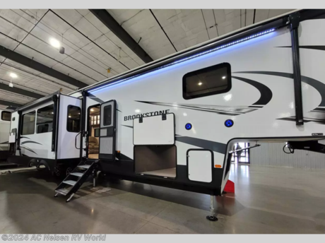 &lt;p&gt;&lt;strong&gt;Coachmen Brookstone fifth wheel 374RK highlights:&lt;/strong&gt;&lt;/p&gt; &lt;ul&gt; &lt;li&gt;Rear Kitchen&lt;/li&gt; &lt;li&gt;Four Slides&lt;/li&gt; &lt;li&gt;Entertainment Center&lt;/li&gt; &lt;li&gt;Dual Sink Vanity&lt;/li&gt; &lt;li&gt;Outside Refrigerator&lt;/li&gt; &lt;li&gt;King Bed Slide Out&lt;/li&gt; &lt;/ul&gt; &lt;p&gt;&#160;&lt;/p&gt; &lt;p&gt;One look at this fifth wheel and you&#39;ll be sold. You&#39;ll find tons of counter space in the rear kitchen along with a &lt;strong&gt;kitchen island&lt;/strong&gt;, a large pantry, and a hutch for even more storage. Visit in the main living area on the&lt;strong&gt; two theater seats&lt;/strong&gt;&#160;and tri-fold sofa, or you may want to head outdoors under the &lt;strong&gt;two power awnings&lt;/strong&gt;! There is even an outside refrigerator here to entertain guests. The spacious full bath will allow you to clean up after a day of adventuring, and here you&#39;ll find a&lt;strong&gt; full-size shower&lt;/strong&gt; with sliding glass doors and a seat, plus a dual sink vanity. The front private bedroom will feel just like home with its king bed slide out, large wardrobe, and dresser to keep your clothes tidy.&lt;/p&gt; &lt;p&gt;&#160;&lt;/p&gt; &lt;p&gt;The Brookstone fifth wheels by Coachmen are coming to you with wide-body comfort, home-like amenities, and unique designs for a truly luxurious RV. The &lt;strong&gt;Weather Shield+&lt;/strong&gt; consists of a 6X double Azdel aluminum cage sidewall system, a Radiant Pro weather barrier system, and more that will help you extend your camping season or go full-time. The &lt;strong&gt;frameless automotive-style windows&lt;/strong&gt; feature 80% privacy tint safety glass, and the vacuum bonded and aluminum framed sidewalls with rot proof Azdel will provide durability. Head inside to find &lt;strong&gt;solid hardwood drawers&lt;/strong&gt;, solid surface countertops in the kitchen, a residential bed with a pillow top mattress and full storage underneath, and the list of comforts goes on! The Brookstone also includes 6-point electric auto-leveling, &lt;strong&gt;marine-grade exterior speakers&lt;/strong&gt; with an LED light, four Solid Step entry steps, and many more exterior conveniences!&lt;/p&gt;&lt;ul&gt;&lt;li&gt;Front Bedroom&lt;/li&gt;&lt;li&gt;Rear Kitchen&lt;/li&gt;&lt;li&gt;Kitchen Island&lt;/li&gt;&lt;/ul&gt;