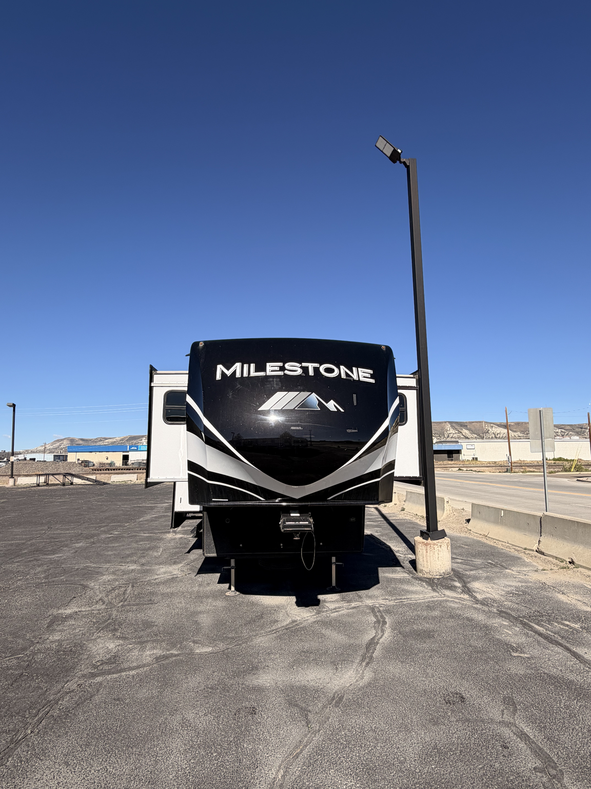 2021 Heartland Milestone 370FLMB - Used Fifth Wheel For Sale by First Choice RVs in Rock Springs, Wyoming features Residential Refrigerator, Fireplace, Toilet, Furnace, Refrigerator