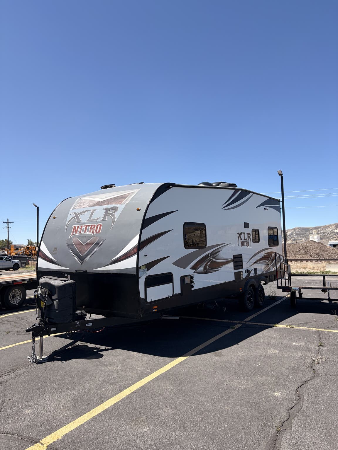 2018 Forest River XLR Nitro 23KW - Used Toy Hauler For Sale by First Choice RVs in Rock Springs, Wyoming features Ladder, Generator, Bluetooth Stereo, Enclosed Underbelly, Leveling Jacks