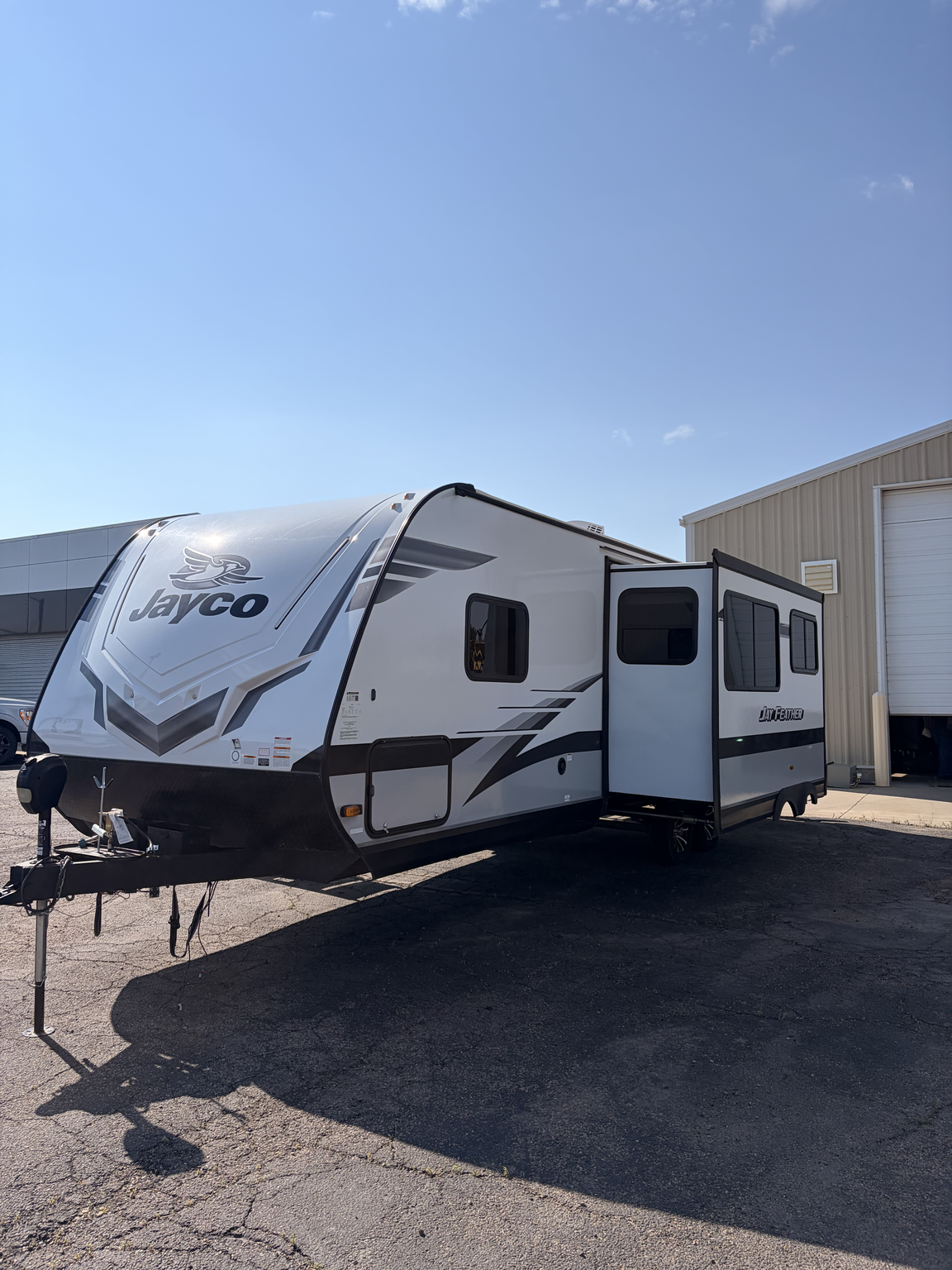 2023 Jayco Jay Feather 27BHB - Used Travel Trailer For Sale by First Choice RVs in Rock Springs, Wyoming features Smoke Detector, Refrigerator, Stove Top Burner, Oven, Theater Seating