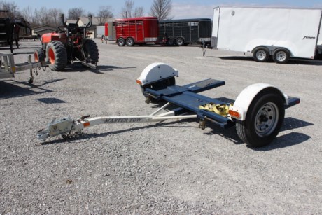 2014 MASTER TOW USED TOW DOLLY WITH HYDRAULIC SURGE BRAKES, 79  WIDE, 10  LONG, DECENT 14  BIAS PLY TIRES, 2  COUPLER, BED TILTS FOR LOADING, STRAPS INCLUDED.