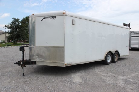 USED 2015 HOMESTEADER 8.5  X 20  ENCLOSED CARGO TRAILER FOR SALE, WHITE, SOME DENTS AND DINGS, AVERAGE CONDITION, 2-5.2K TORSION AXLES, REAR AXLE BENT SPINDLE, NEEDS ONE NEW TIRE, SIDE DOOR WITH BAR LOCK, REAR RAMP DOOR, PLYWOOD FLOOR AND WALLS, 80  INTERIOR HEIGHT, ELECTRIC TONGUE JACK, 2-5/16  COUPLER, TRIPLE TUBE TONGUE. SELLING AS IS.