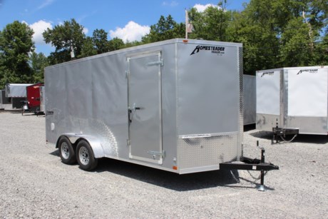 2023 HOMESTEADER 7  X 16  ENCLOSED CARGO TRAILER, V-NOSE WITH FRONT STONEGUARD, 78  INTERIOR HEIGHT, SILVER ALUMINUM EXTERIOR, 2-3.5K ELECTRIC BRAKE AXLES, SPRING SUSPENSION, 15  RADIAL TIRES, 32  SIDE DOOR WITH BAR LOCK, REAR RAMP DOOR WITH EXTENDED WOOD FLAP, 3/4  PLYWOOD FLOOR, 3/8  PLYWOOD WALLS, 16  ON CENTER FLOOR CROSSMEMBERS AND WALL POSTS, (4) FLOOR MOUNT D-RINGS, FLOW THRU VENTS - SIDEWALL, DOME LIGHT, LED EXTERIOR LIGHTS, 2-5/16  COUPLER, A-FRAME JACK.