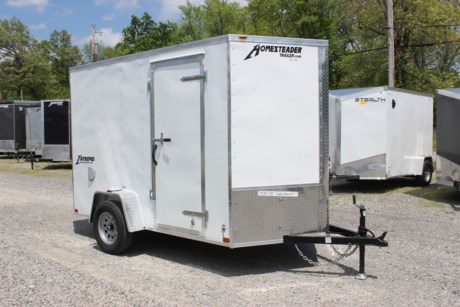 2022 HOMESTEADER 6  X 10  ENCLOSED CARGO TRAILER FOR SALE, WHITE EXTERIOR ALUMINUM, 24  V-NOSE, 78  INTERIOR HEIGHT, 16  ON CENTER WALL POSTS, 32  SIDE DOOR WITH BAR LOCK, REAR RAMP DOOR WITH EXTENDED WOOD FLAP, 3/4  PLYWOOD FLOOR, 3/8  PLYWOOD WALLS, (4) FLOOR MOUNT D-RINGS, SIDE WALL FLOW THRU VENTS, INTERIOR DOME LIGHT, 3.5K IDLER AXLE, SPRING SUSPENSION, 15  RADIAL TIRES, LED EXTERIOR LIGHTS, A-FRAME JACK, 2  COUPLER.