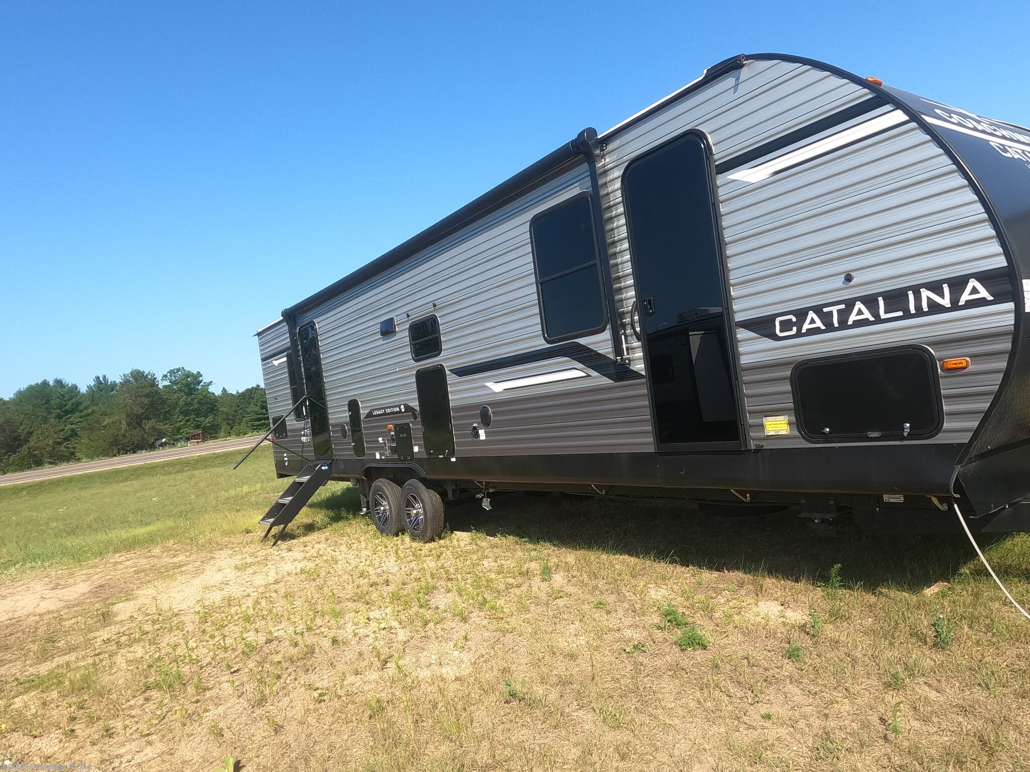 2026 Coachmen Catalina Legacy Edition 333DORM - New Travel Trailer For Sale by Friendship RV Inc. in Friendship, Wisconsin features Exterior Speakers, Stabilizer Jacks, Toilet, Bunk Beds, Booth Dinette