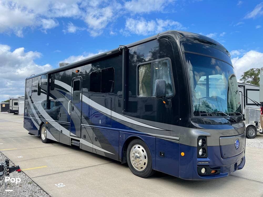 2018 Holiday Rambler Navigator XE 35E - Used Diesel Pusher For Sale by Pop RVs in Melbourne, Florida features Generator, Leveling Jacks, Slideout, Air Conditioning, Awning