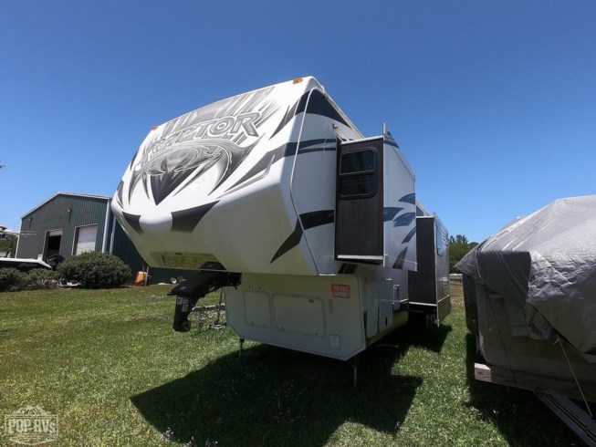 2014 Keystone Raptor 395LEV - Used Toy Hauler For Sale by Pop RVs in St Augustine, Florida features Air Conditioning, Leveling Jacks, Slideout, Awning, Generator