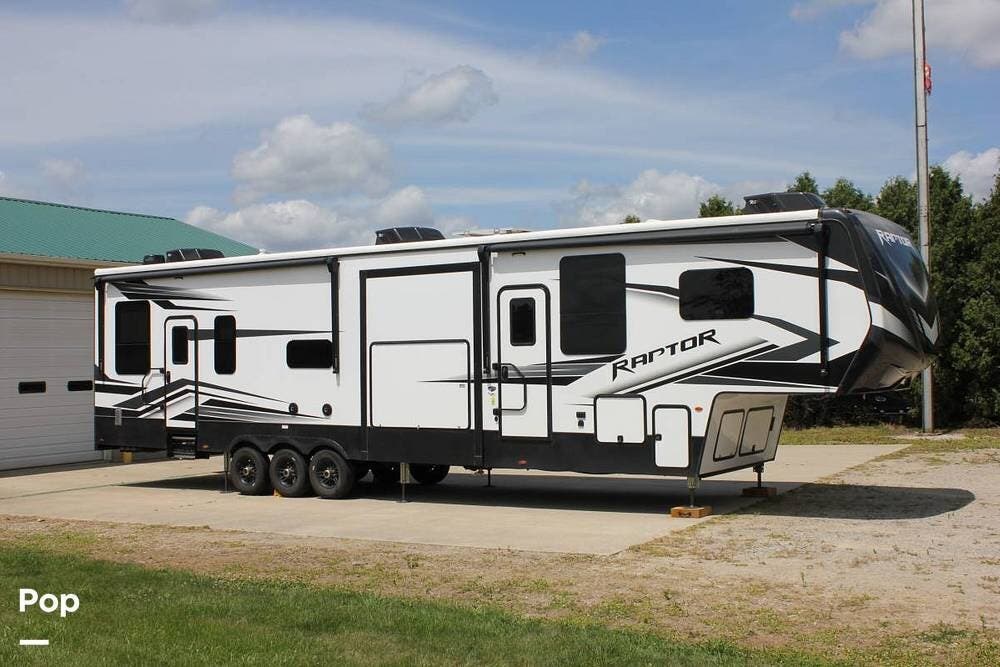 2022 Keystone Raptor 423 - Used Toy Hauler For Sale by Pop RVs in Irons, Michigan features Leveling Jacks, Slideout, Air Conditioning, Awning, Generator
