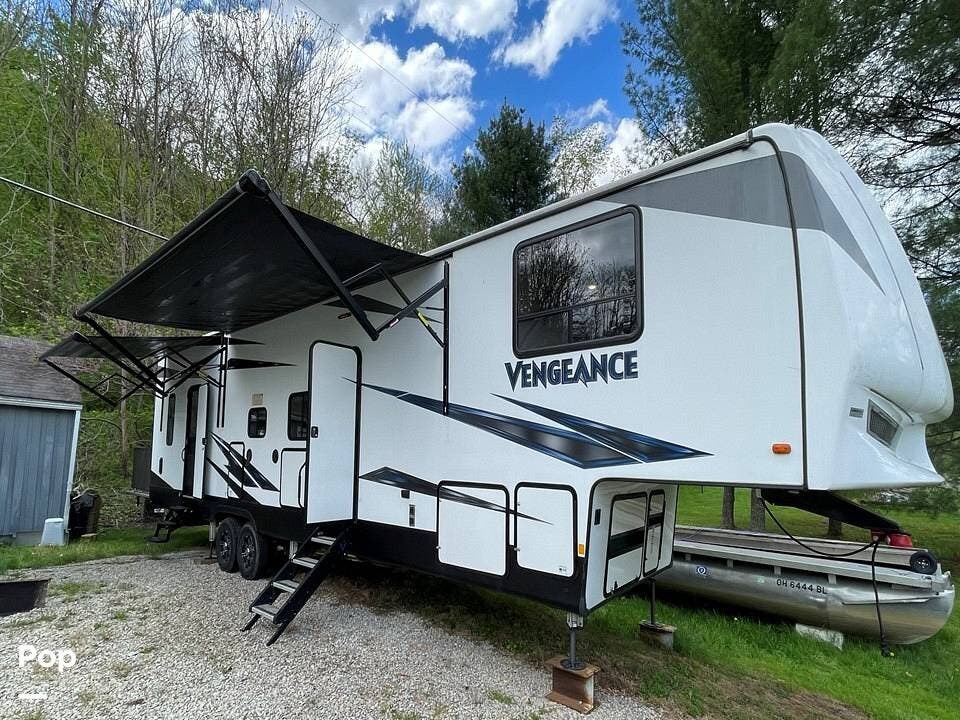2019 Forest River Vengeance 345A13 - Used Toy Hauler For Sale by Pop RVs in Blue Rock, Ohio features Leveling Jacks, Awning, Slideout, Generator, Air Conditioning