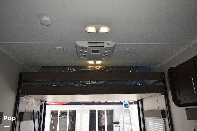 2022 Dune Sport Man Cave DYNAMITE FIRESTORM CB - Used Toy Hauler For Sale by Pop RVs in Iowa Park, Texas features Leveling Jacks, Air Conditioning, Awning