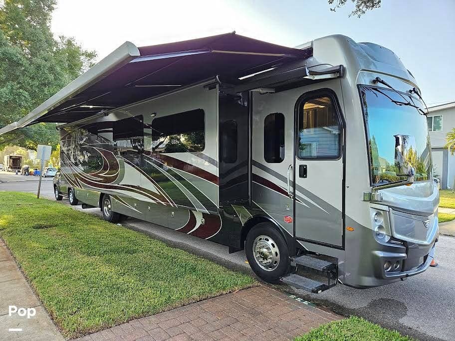 2022 Fleetwood Discovery LXE 40G - Used Diesel Pusher For Sale by Pop RVs in Englewood, Florida features Awning, Air Conditioning, Generator, Leveling Jacks, Slideout