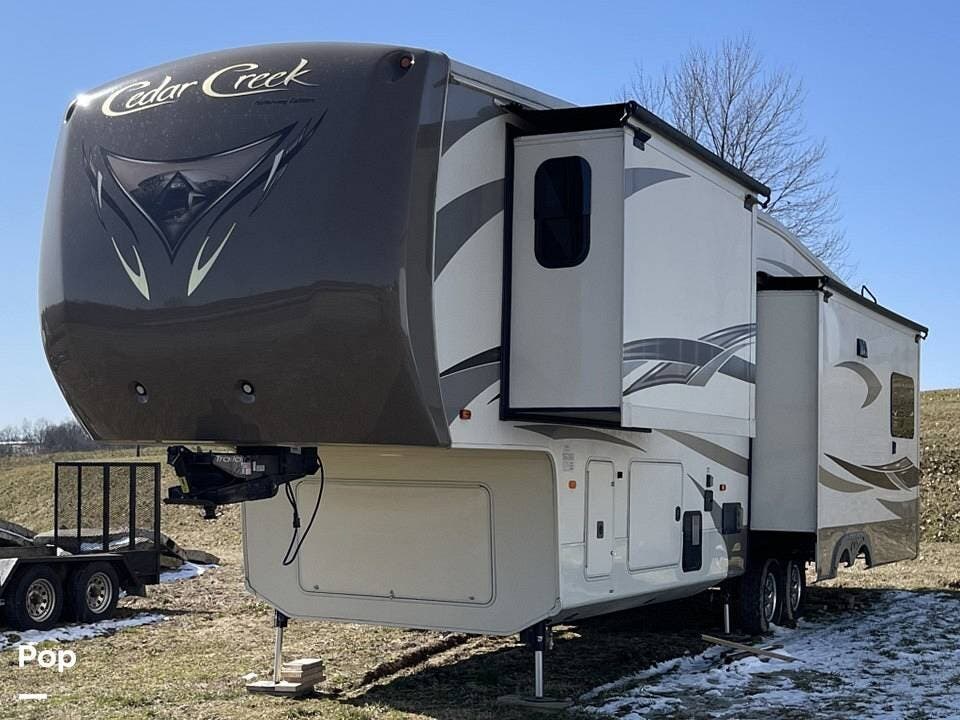 2016 Forest River Cedar Creek 36CKTS - Used Fifth Wheel For Sale by Pop RVs in Zanesville, Ohio features Leveling Jacks, Slideout, Awning, Air Conditioning