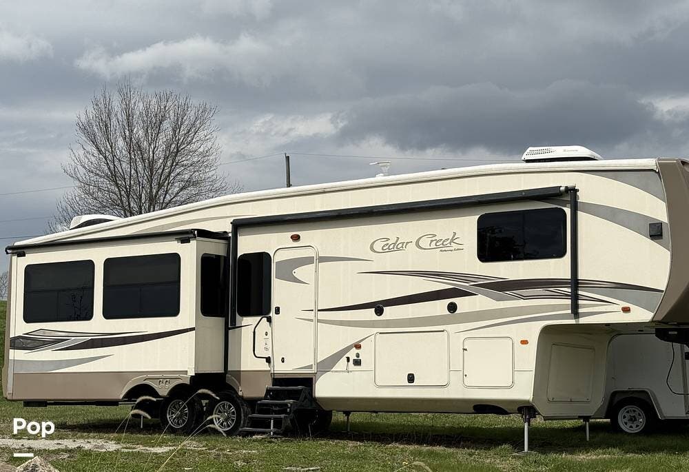 2016 Forest River Cedar Creek 36CKTS - Used Fifth Wheel For Sale by Pop RVs in Zanesville, Ohio features Slideout, Leveling Jacks, Air Conditioning, Awning