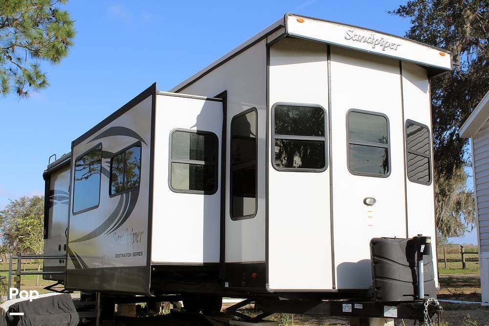 2022 Forest River Sandpiper 401FLX - Used Park Model For Sale by Pop RVs in Fort Meade, Florida features Leveling Jacks, Slideout, Awning, Air Conditioning