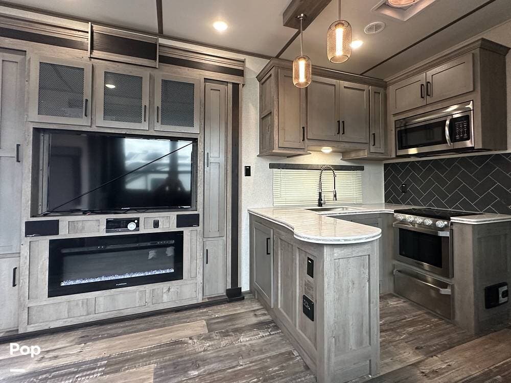 2020 Keystone Raptor 423 - Used Toy Hauler For Sale by Pop RVs in Deforest, Wisconsin features Slideout, Awning, Leveling Jacks, Air Conditioning, Generator