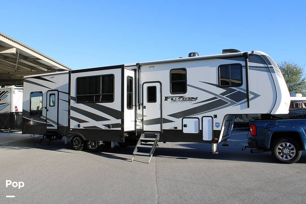 2020 Keystone Fuzion Impact 367 - Used Toy Hauler For Sale by Pop RVs in Polk City, Florida features Leveling Jacks, Generator, Awning, Slideout, Air Conditioning