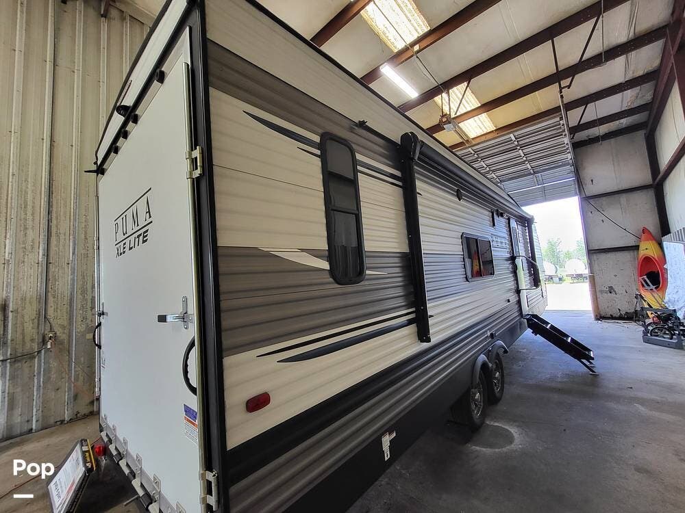 2022 Palomino Puma 27QBC - Used Toy Hauler For Sale by Pop RVs in Little Rock, Arkansas features Awning, Leveling Jacks, Air Conditioning
