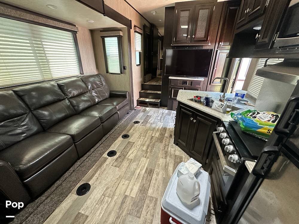 2019 Heartland Fuel 335 - Used Toy Hauler For Sale by Pop RVs in Norman, Oklahoma features Generator, Leveling Jacks, Air Conditioning, Awning, Slideout