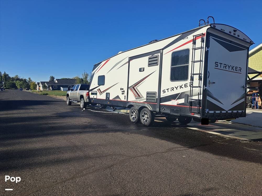 2022 Cruiser RV Stryker 2613 - Used Toy Hauler For Sale by Pop RVs in Hagerman, Idaho features Leveling Jacks, Awning, Slideout, Generator, Air Conditioning